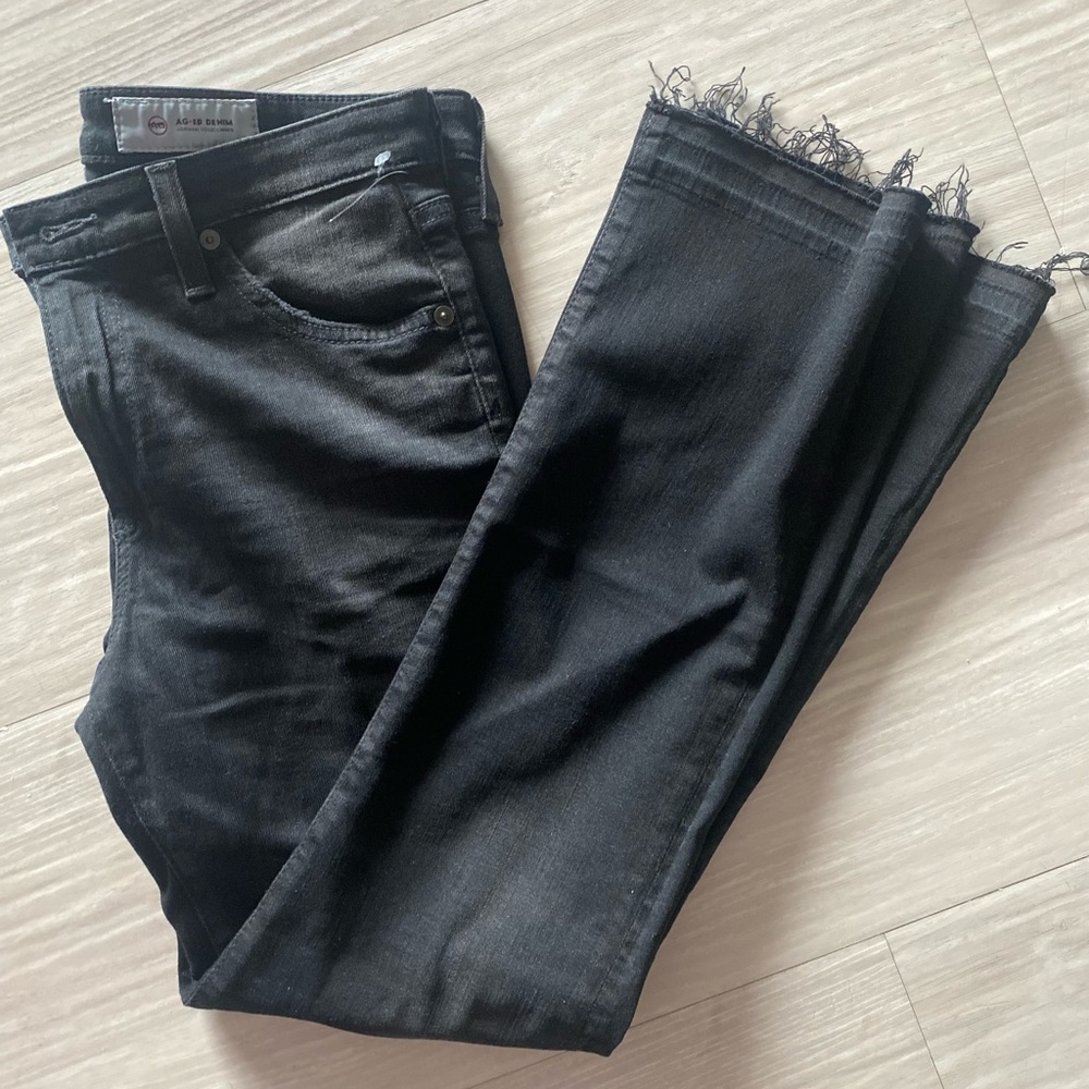 AG black denim with a raw hem size 28